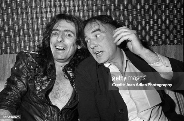 Singer, songwriter and musician Alice Cooper with Actor Albert Finney chatting backstage at Cooper's "Special Forces Tour" at the Greek Theatre on...