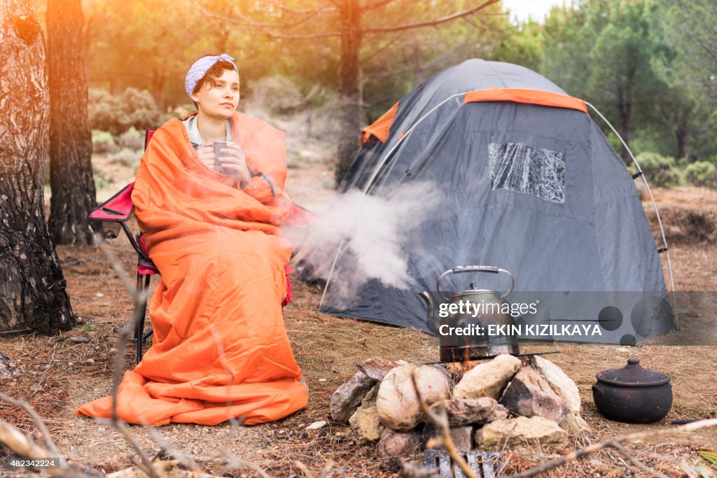 Camper sitting by the campfire