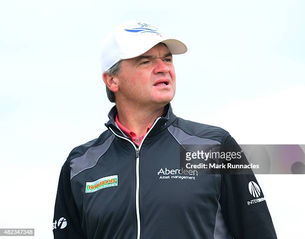 Paul Lawrie of Scotland watches his drive from the first tee during the first day of the Saltire Energy Paul Lawrie Matchplay at Murcar Links Golf...