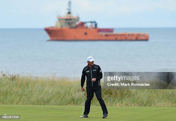 Paul Lawrie of Scotland looks for the line of a putt on the 4th green during the first day of the Saltire Energy Paul Lawrie Matchplay at Murcar...