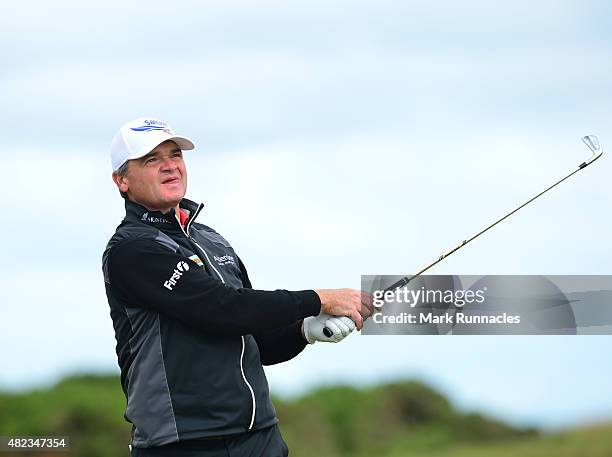 Paul Lawrie of Scotland watches his approach shot to the 3rd green during the first day of the Saltire Energy Paul Lawrie Matchplay at Murcar Links...