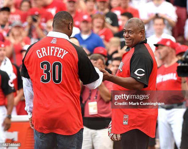 Former Major League Baseball players Ken Griffey Jr. And his father Ken Griffey Sr. Stand together on the field prior to the Gillette Home Run Derby...