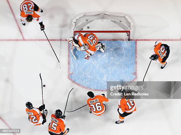 Claude Giroux, Michael Raffl, Tye McGinn, Ray Emery, Zac Rinaldo, Adam Hall and Brayden Schenn of the Philadelphia Flyers warm up prior to their game...