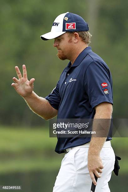 Holmes of the United States reacts on the ninth hole during round one of the Shell Houston Open at the Golf Club of Houston on April 3, 2014 in...