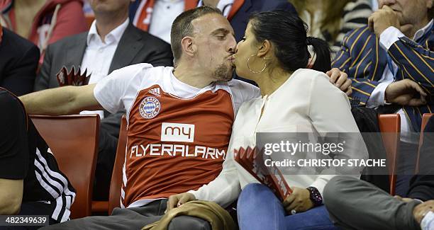 Bayern Munich's French football midfielder Franck Ribery kisses his wife Wahiba Belhami during the Euroleague top 16ten match FC Bayern Basketball vs...