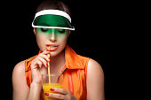 Stylish Sporty Woman Sipping a Glass of Juice. Beauty Dieting