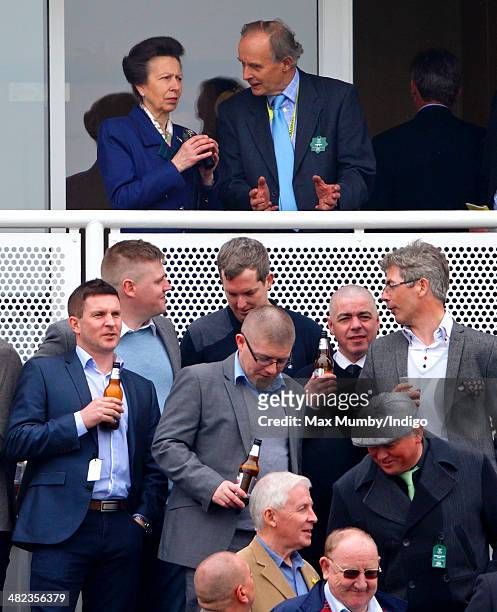 Princess Anne, The Princess Royal watches the racing as she attends day 1 of the Crabbie's Grand National horse racing meet at Aintree Racecourse on...