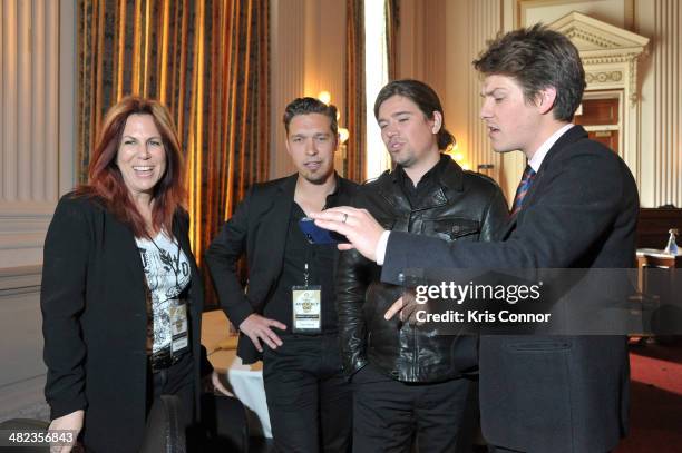 Victoria Shaw, Zac Hanson, Taylor Hanson and Isaac Hanson perform during an issue briefing to kick off the Grammy's on the hill lobbying day at...