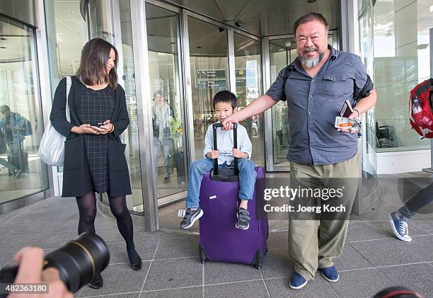 Chinese dissident artist Ai Weiwei leaves Munich Airport with is his wife Wang Fen and his son Ai Lao, aged 6, on July 30, 2015 in Munich, Germany....