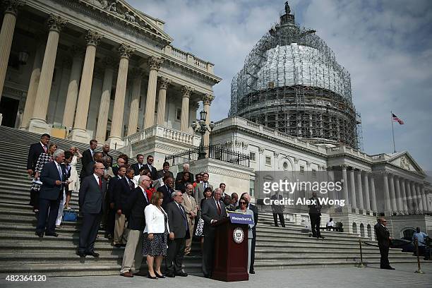 Flanked by Congressional members, U.S. House Democratic Whip Rep. Steny Hoyer speaks during a rally in front of the U.S. Capitol July 30, 2015 on...