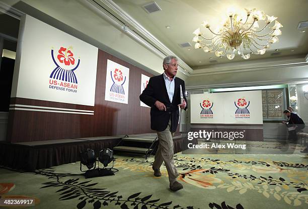 Secretary of Defense Chuck Hagel leaves after the closing news conference for a meeting of defense ministers from the Association of Southeast Asian...