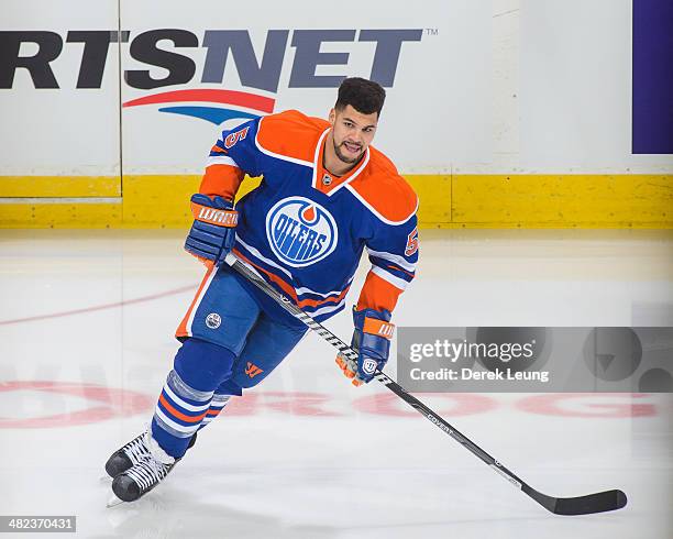 Mark Fraser of the Edmonton Oilers in action against the San Jose Sharks during an NHL game at Rexall Place on March 25, 2014 in Edmonton, Alberta,...