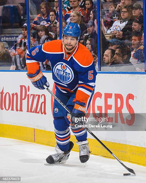 Mark Fraser of the Edmonton Oilers in action against the San Jose Sharks during an NHL game at Rexall Place on March 25, 2014 in Edmonton, Alberta,...