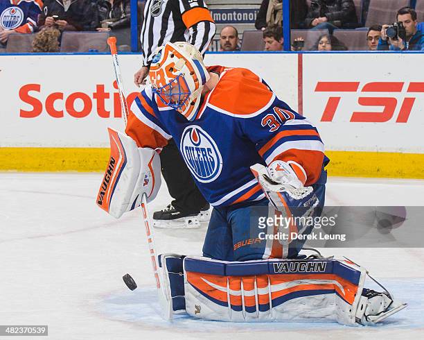 Ben Scrivens of the Edmonton Oilers in action against the San Jose Sharks during an NHL game at Rexall Place on March 25, 2014 in Edmonton, Alberta,...