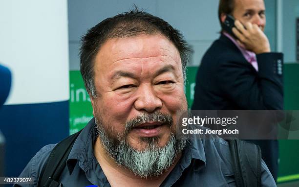Chinese dissident artist Ai Weiwei speaks to the media upon his arrival at Munich Airport on July 30, 2015 in Munich, Germany. This is his first trip...