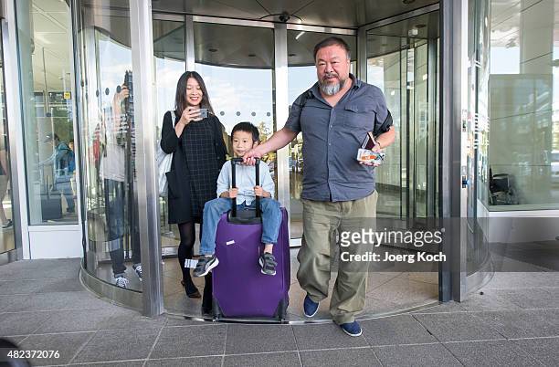 Chinese dissident artist Ai Weiwei leaves Munich Airport with is his wife Wang Fen and his son Ai Lao, aged 6, on July 30, 2015 in Munich, Germany....