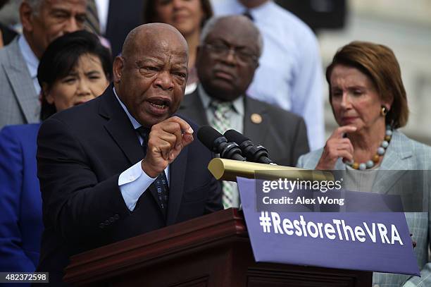 Rep. John Lewis speaks as Rep. Judy Chu , House Assistand Democratic Leader Rep. James Clyburn , and House Democratic Leader Rep. Nancy Pelosi listen...