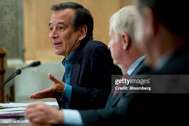 James "Jim" Koch, founder and chairman of the Boston Beer Co. Inc., left, speaks during a Senate Permanent Subcommittee on Investigations hearing...