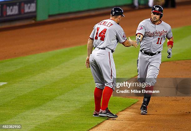 Ryan Zimmerman of the Washington Nationals is congratulated after hitting a solo home run during a game against the Miami Marlins at Marlins Park on...