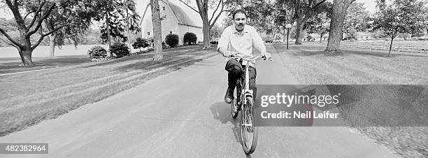 Panoramic portrait of former heavyweight champion Muhammad Ali riding his bicycle during photo shoot at his farm on Kephart Road near Berrien...