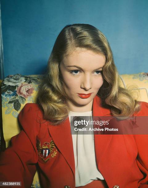 American actress Veronica Lake wearing a red blazer, circa 1950.