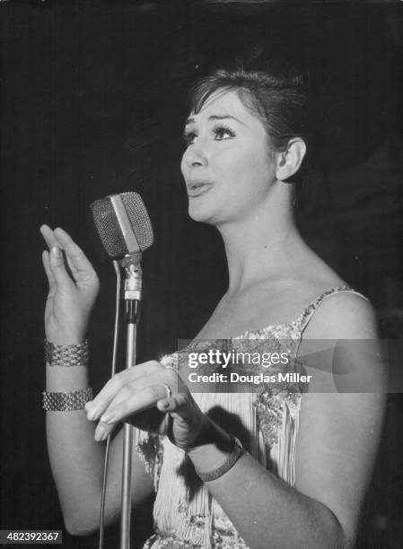 Model April Ashley rehearsing her speech for the evening at the Astor Club, London, May 14th 1962.