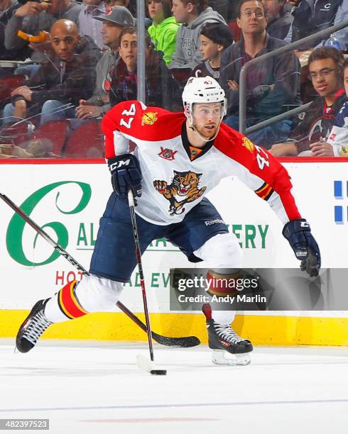 Colby Robak of the Florida Panthers plays the puck against the New Jersey Devils during the game at the Prudential Center on March 31, 2014 in...