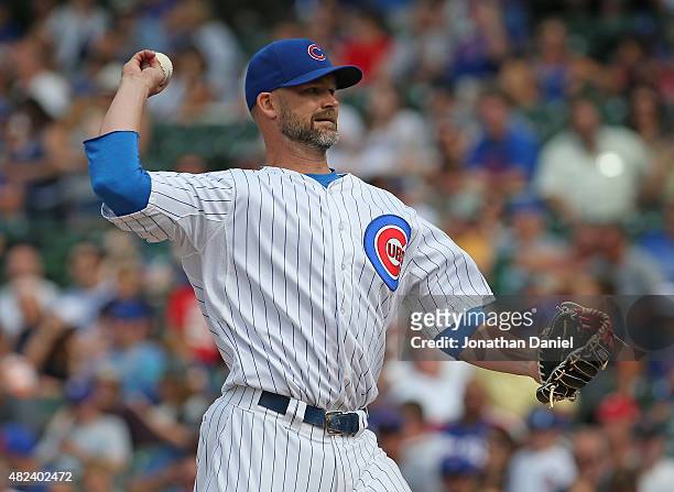 David Ross of the Chicago Cubs, normally a catcher, pitches a scoreless 9th inning against the Philadelphia Phillies at Wrigley Field on July 26,...