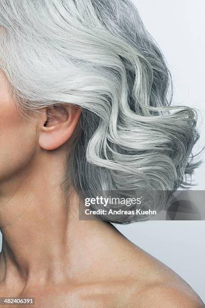 grey haired woman profile, cropped. - schulterlanges haar stock-fotos und bilder