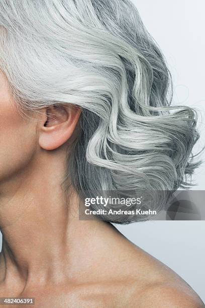 grey haired woman profile, cropped. - cabello gris fotografías e imágenes de stock