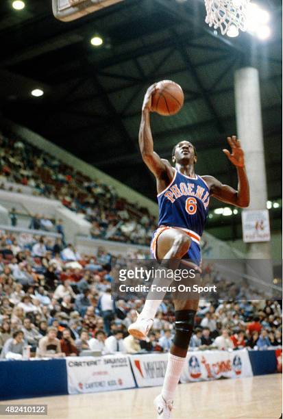 Walter Davis of the Phoenix Suns goes up for a layup against the New Jersey Nets during an NBA basketball game circa 1981 at the Rutgers Athletic...