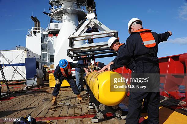 In this handout image provided by the U.S. Navy, The Bluefin 21, Artemis autonomous underwater vehicle is hoisted back on board the Australian...