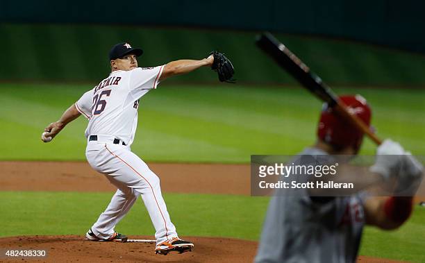 Scott Kazmir of the Houston Astros throws a pitch in the first inning to Albert Pujols of the Los Angeles Angels of Anaheim during their game at...