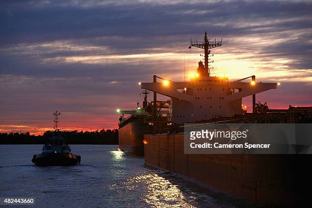Tugboat Master John Duncan and other tugboats assist the 'Oriental Treasure' bulk carrier ship from Kooragang Island Coal Terminal through Newcastle...