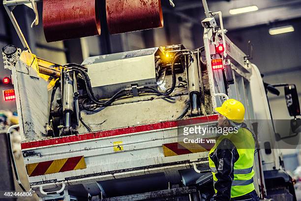 garbage truck with worker - dustbin lorry stock pictures, royalty-free photos & images