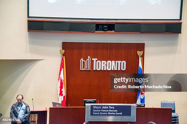 Toronto Council Chamber inside the new city hall, seat of the mayor flanked by the national and provincial flag.