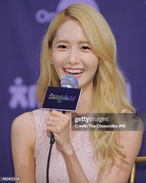 Girls' Generation pose for photographs during the OnStyle 'Channel Girls' Generation' press conference at Imperial Palace on July 21, 2015 in Seoul,...