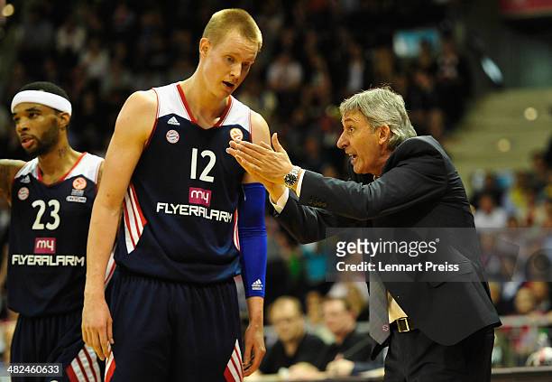 Svetislav Pesic , head coach of Munich talks to Robin Benzing during the Turkish Airlines Euroleague Top 16 Round 13 Group F basketball match between...