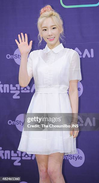 Girls' Generation pose for photographs during the OnStyle 'Channel Girls' Generation' press conference at Imperial Palace on July 21, 2015 in Seoul,...