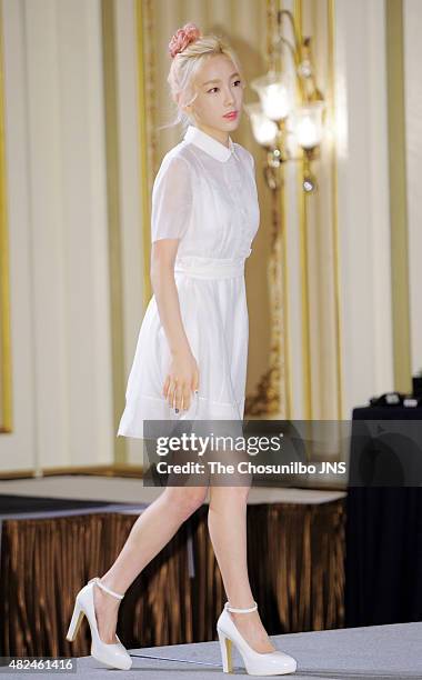 Girls' Generation pose for photographs during the OnStyle 'Channel Girls' Generation' press conference at Imperial Palace on July 21, 2015 in Seoul,...