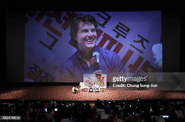 Tom Cruise and Christopher McQuarrie make a guest appearance at the screening of 'Mission: Impossible - Rogue Nation' at the Superplex G theater,...
