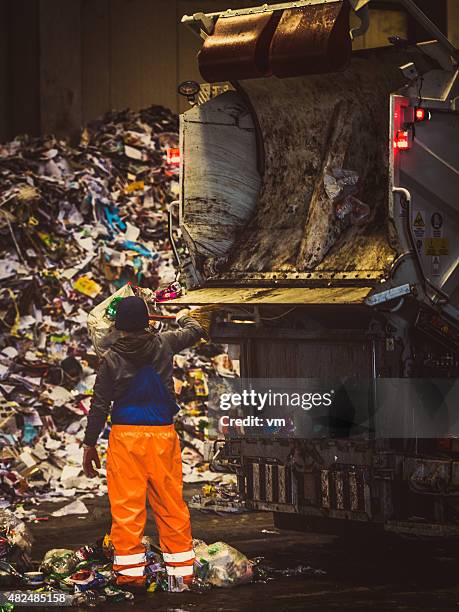 garbage truck with worker - dustbin lorry stock pictures, royalty-free photos & images