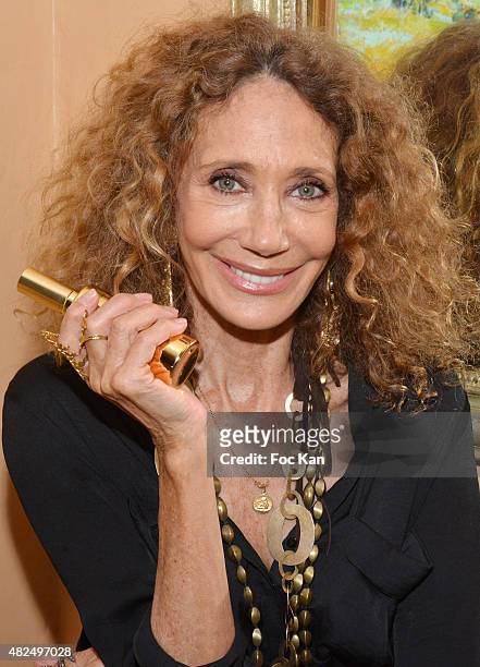 Maria Berenson poses with a flask of prickly pear oil at Hotel de La Ponche during the Marisa Berenson Launches Her Cosmetics Line At Saint Tropez -...