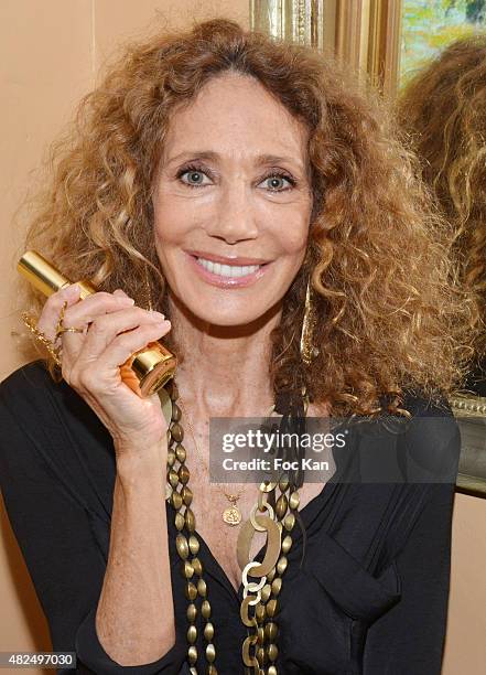 Maria Berenson poses with a flask of prickly pear oil at Hotel de La Ponche during the Marisa Berenson Launches Her Cosmetics Line At Saint Tropez -...