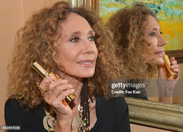 Maria Berenson poses with a flask of prickly pear oil at Hotel de La Ponche during the Marisa Berenson Launches Her Cosmetics Line At Saint Tropez -...