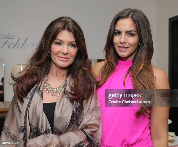 Personalities Lisa Vanderpump and Katie Maloney attend Katie Maloney's Pucker and Pout launch party at Frederic Fekkai Hair Salon on July 30, 2015 in...