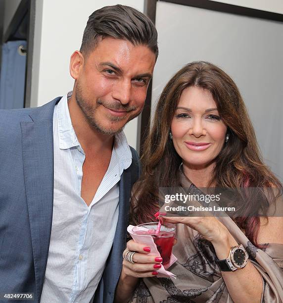 Personalities Jax Taylor and Lisa Vanderpump attend Katie Maloney's Pucker and Pout launch party at Frederic Fekkai Hair Salon on July 30, 2015 in...