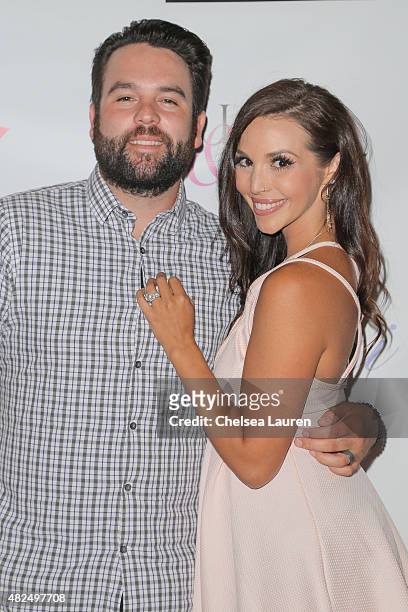 Personalities Mike Shay and Scheana Marie attend Katie Maloney's Pucker and Pout launch party at Frederic Fekkai Hair Salon on July 30, 2015 in...