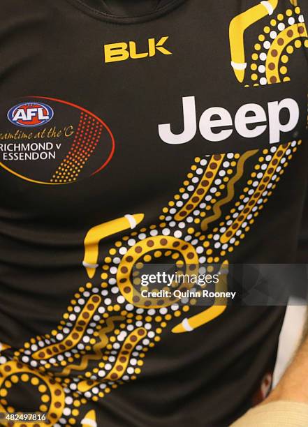 The Tigers wear the dreamtime guernsey during the round 18 AFL match between the Hawthorn Hawks and the Richmond Tigers at Melbourne Cricket Ground...