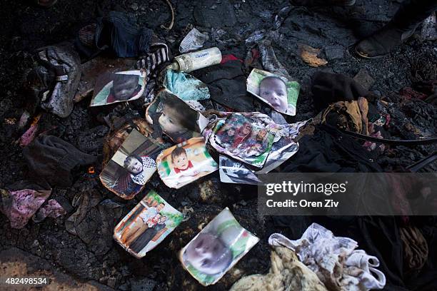 Family members and relatives of 18 month old baby, Ali Saad-Dawabsheh, view the remains of their house after a fire which was suspected to have been...